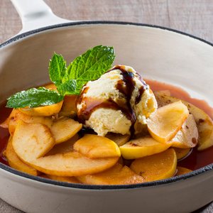Sliced apple with sweet and sour sauce and ice cream